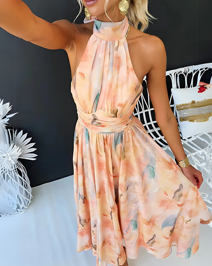 Vestido comprido com decote haltere com estampado de aguarela e costas abertas