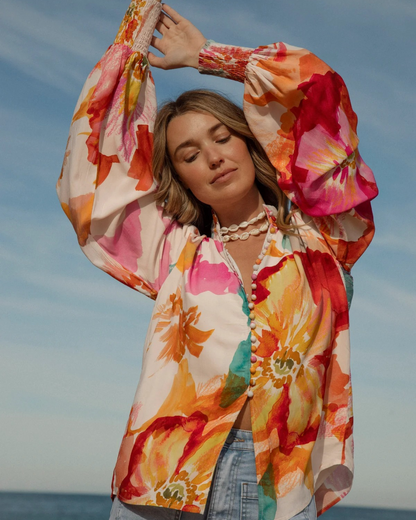 Blusa folgada com decote em V e mangas compridas