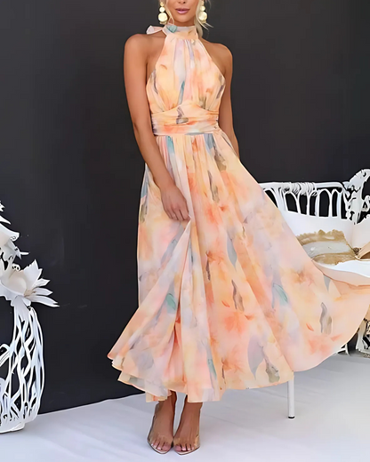 Vestido comprido com decote haltere com estampado de aguarela e costas abertas