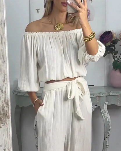 Conjunto de blusa com ombros descobertos e calças Palazzo