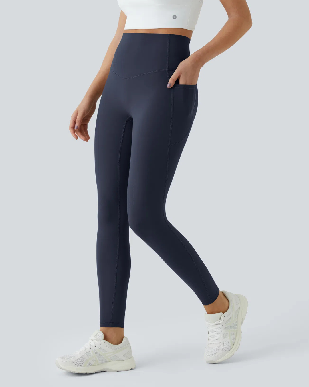 Legging modeladora com cintura alta, controle abdominal e bolsos laterais para treino
