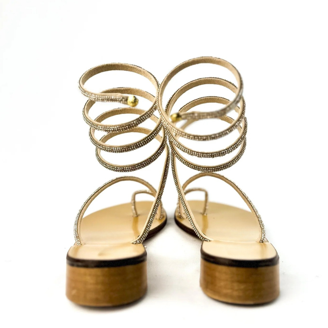 Sandálias rasas com tiras em espiral e brilhantes