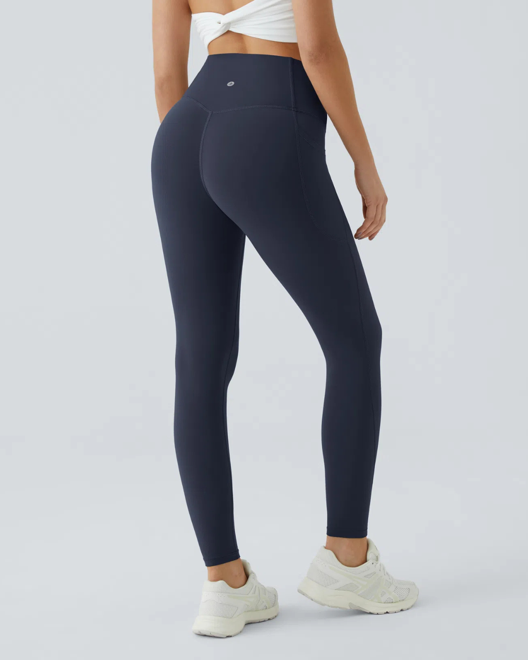Legging modeladora com cintura alta, controle abdominal e bolsos laterais para treino