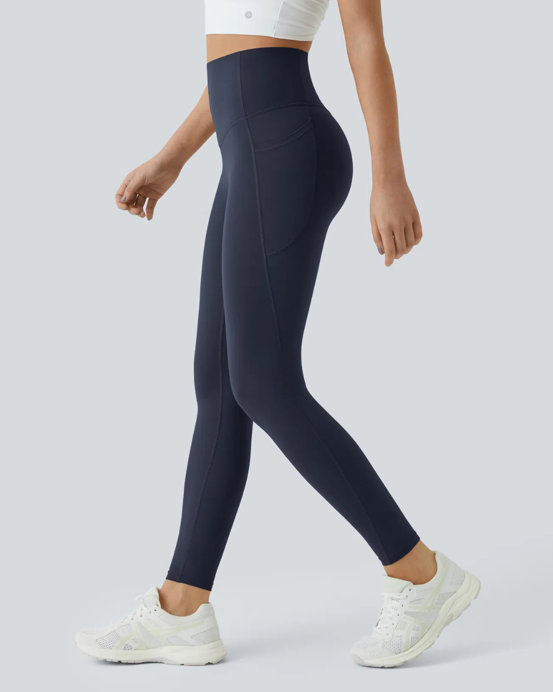 Legging modeladora com cintura alta, controle abdominal e bolsos laterais para treino
