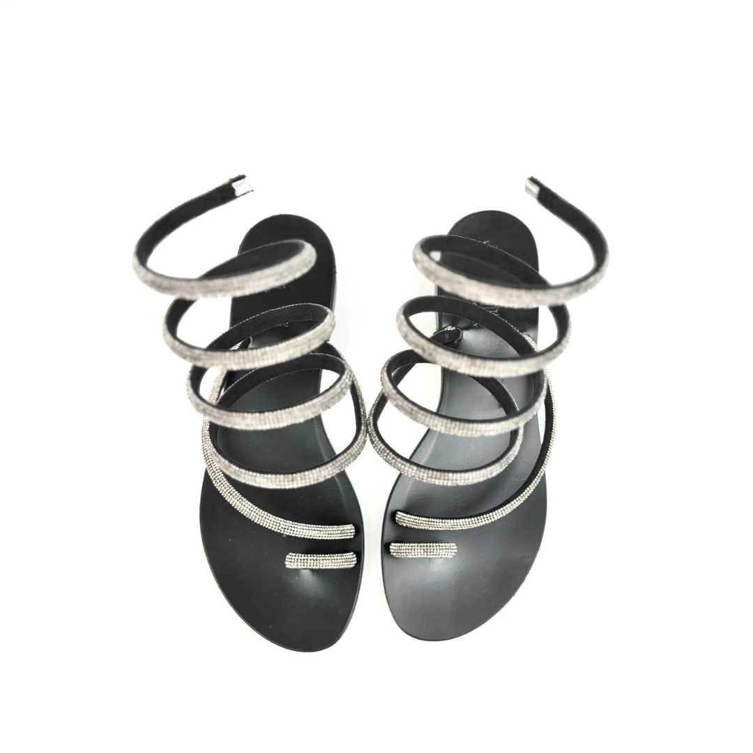 Sandálias rasas com tiras em espiral e brilhantes